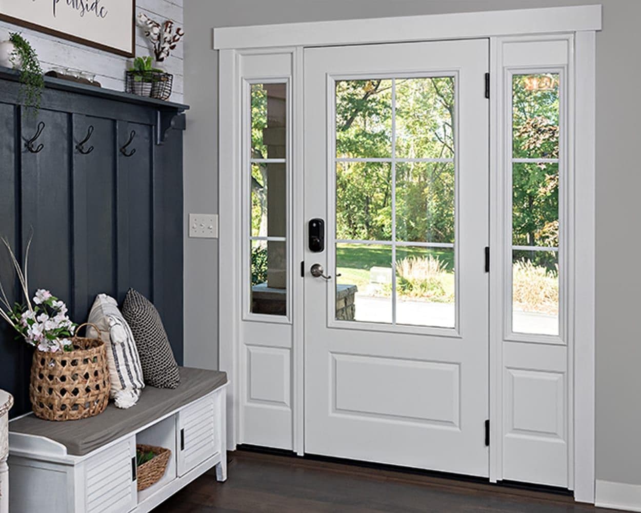 A ProVia entry door with sidelites and decorative glass, viewed from a styled foyer