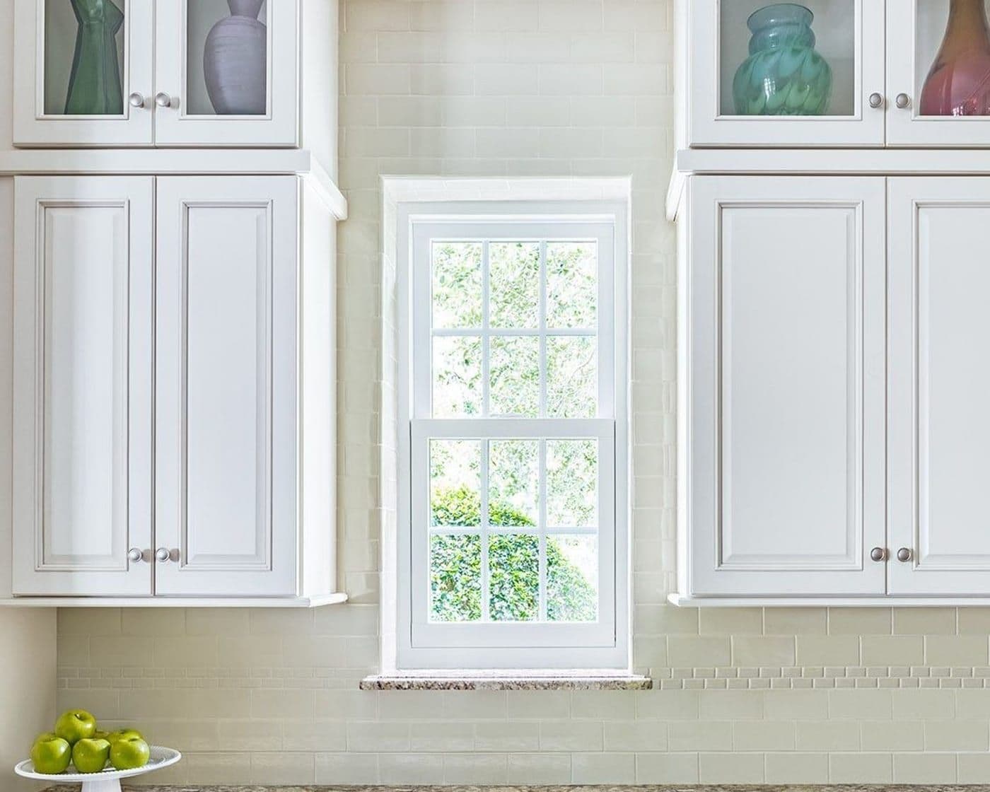 A bright residential kitchen with new windows — the kind of space a Bluebonnet consultation begins around the table